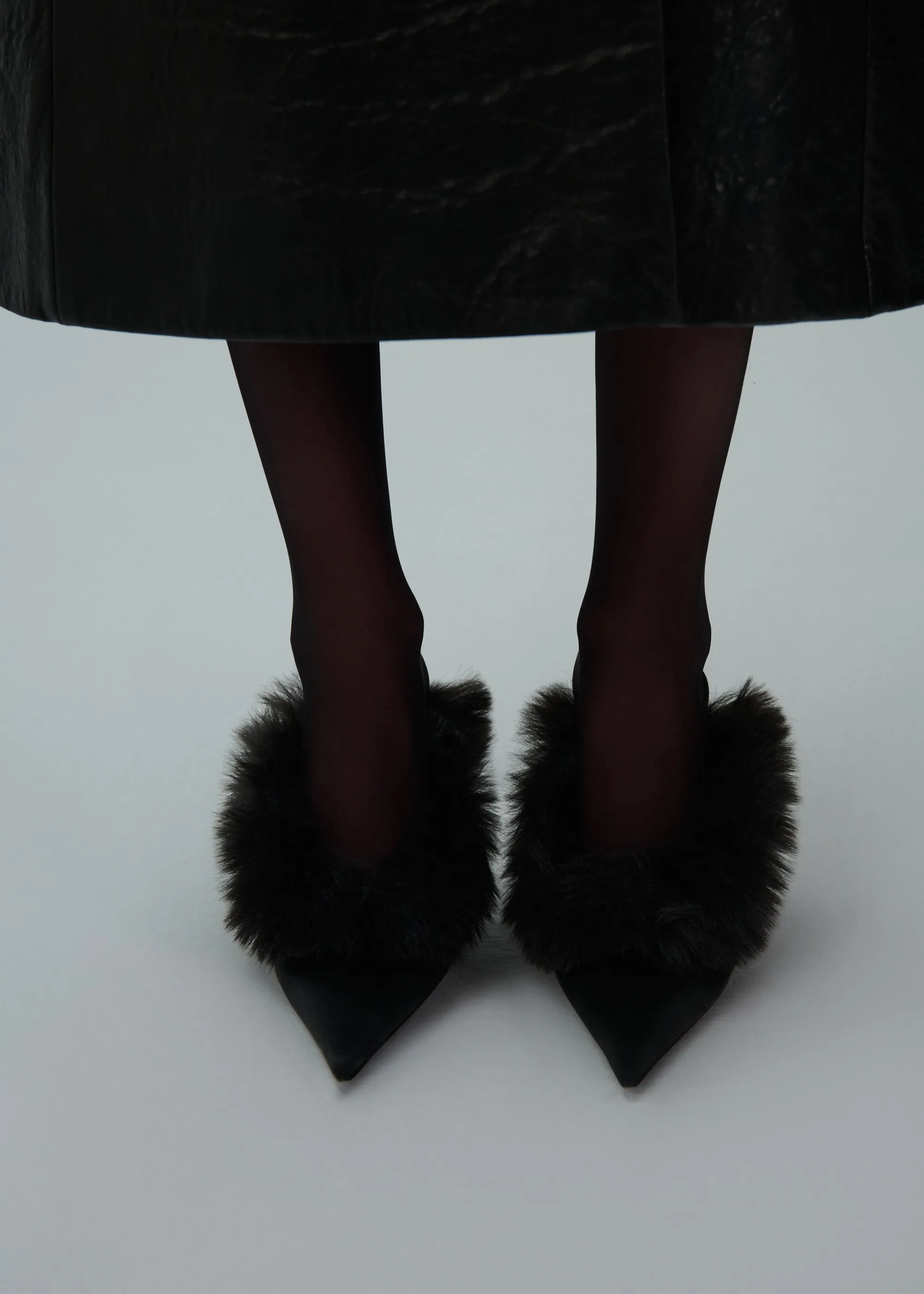 Pointed-toe faux-fur mules in black satin